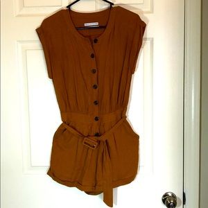 Linen cap sleeve romper with belt.